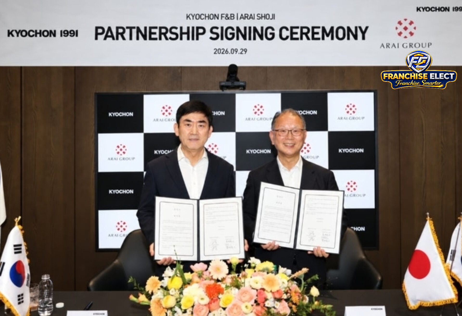 `Kyochon F&B and Arai Shoji partnership signing ceremony on September 29 2026 for Kyochon Chicken return to Japan in 2027, executives holding MOU documents with South Korea and Japan flags - Image Courtesy: Kyochon Chicken`