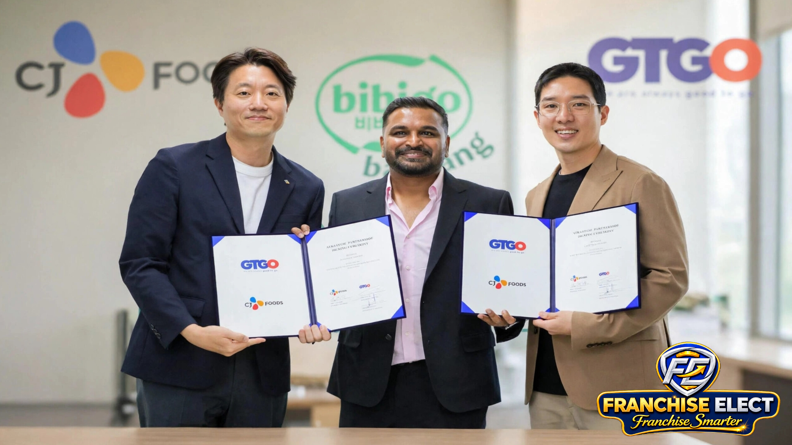 CJ Foods and GTGO strategic partnership signing ceremony for Bibigo brand expansion in India, executives holding MOU documents with CJ Foods and GTGO logos`